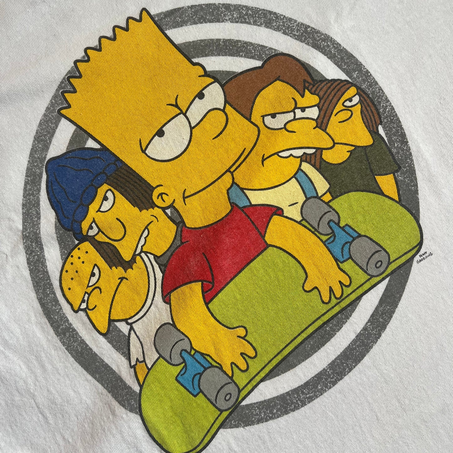 Bart Simpson holding a skateboard graphic print on a white t-shirt