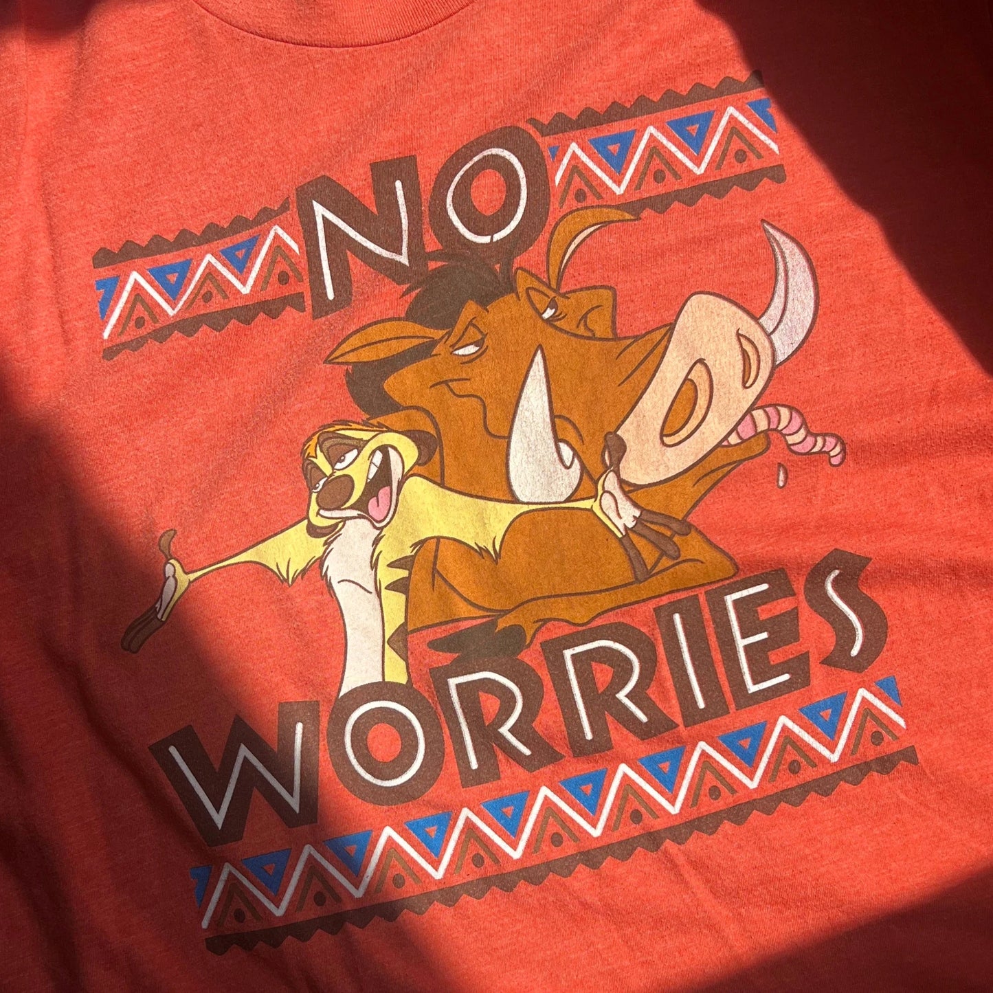 Orange t-shirt with No Worries text
