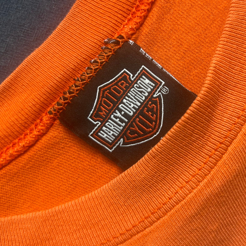 Laid flat_ 100% cotton orange tank tops Harley Davidson logo on clothing neck label