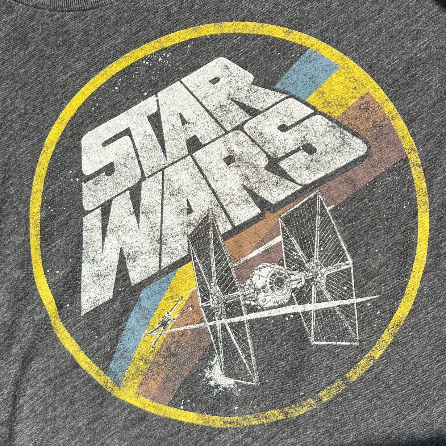 Dark gray t-shirt with Star Wars logo and a TIE Fighter print