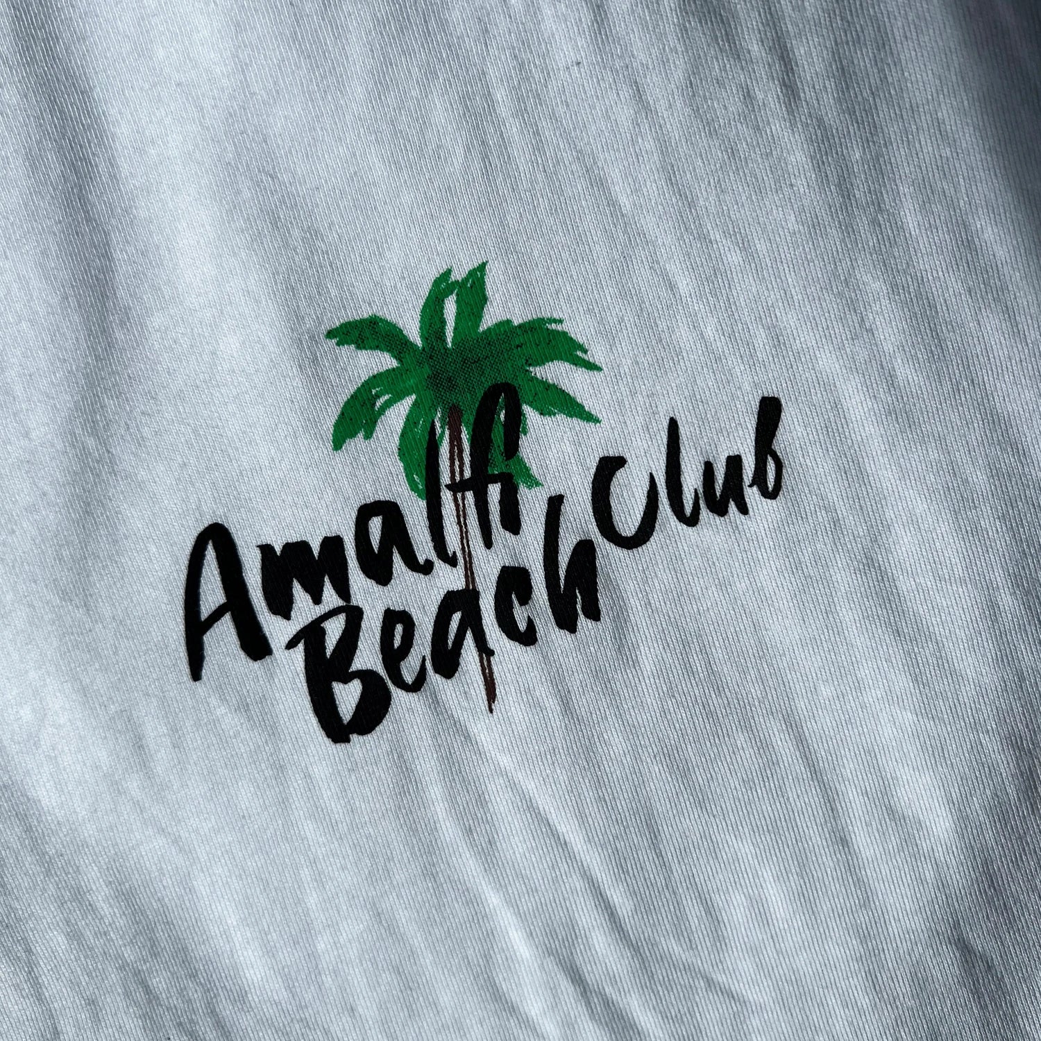 100% cotton white t-shirt with Amalfi Beach club text 