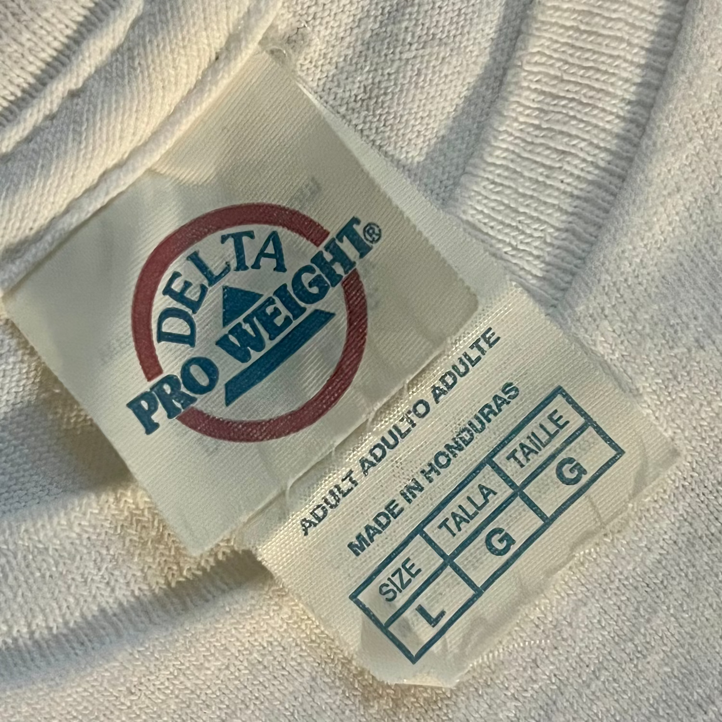 Delta Pro Weight carelabel on a white t-shirt