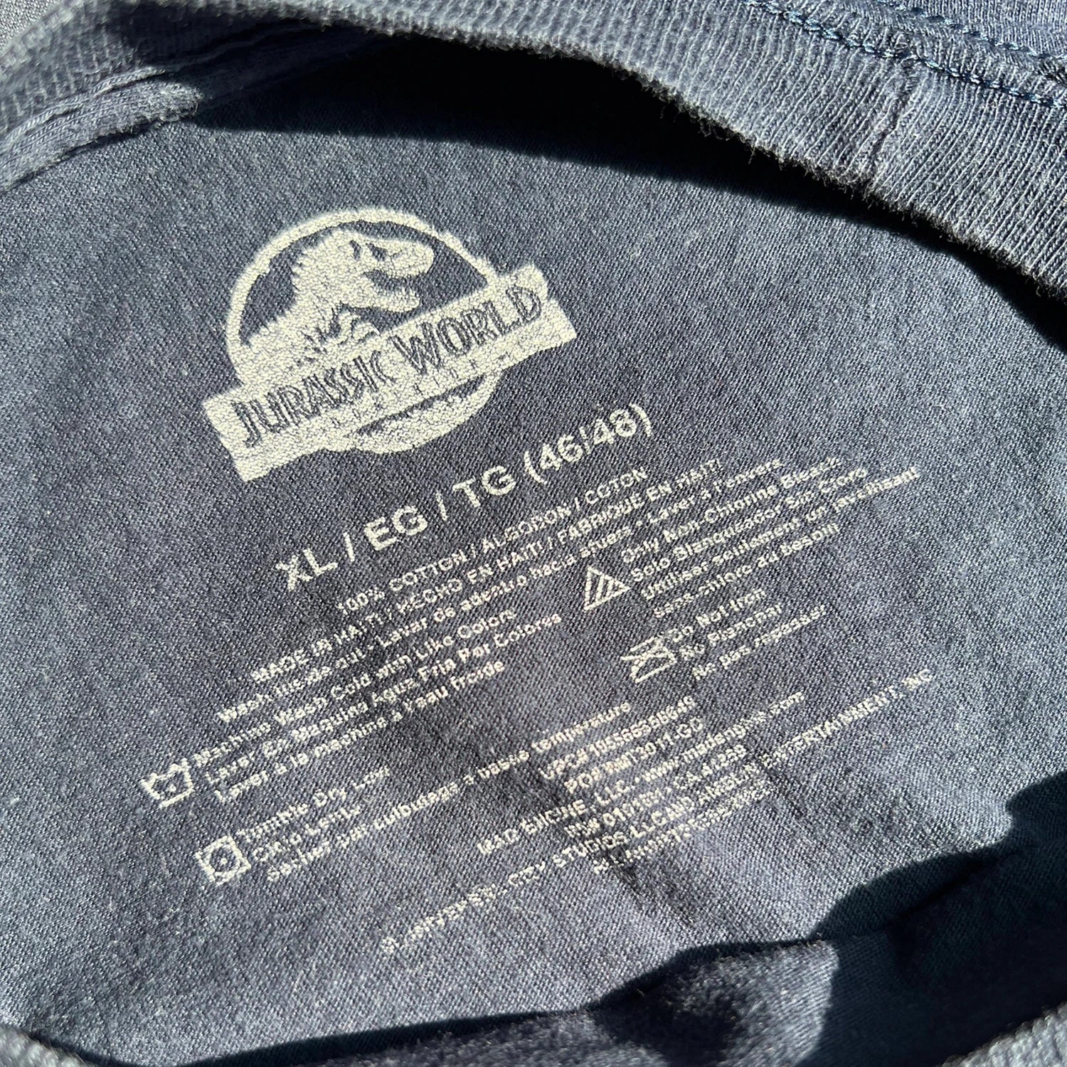 Dark Blue T-shirt with 'Jurassic World' logo and garment information