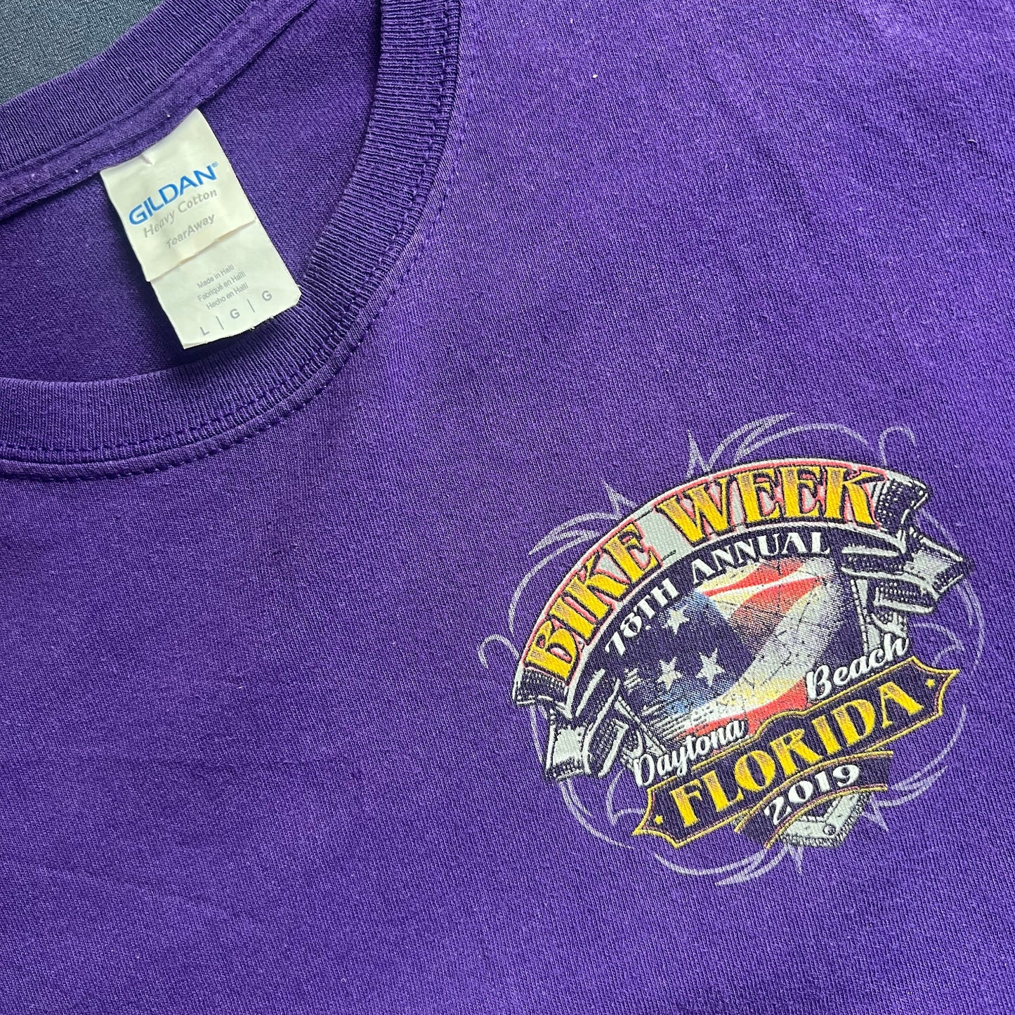 Purple t-shirt with a Gidan logo on clothing neck label and a bike week daytona beach logo on front