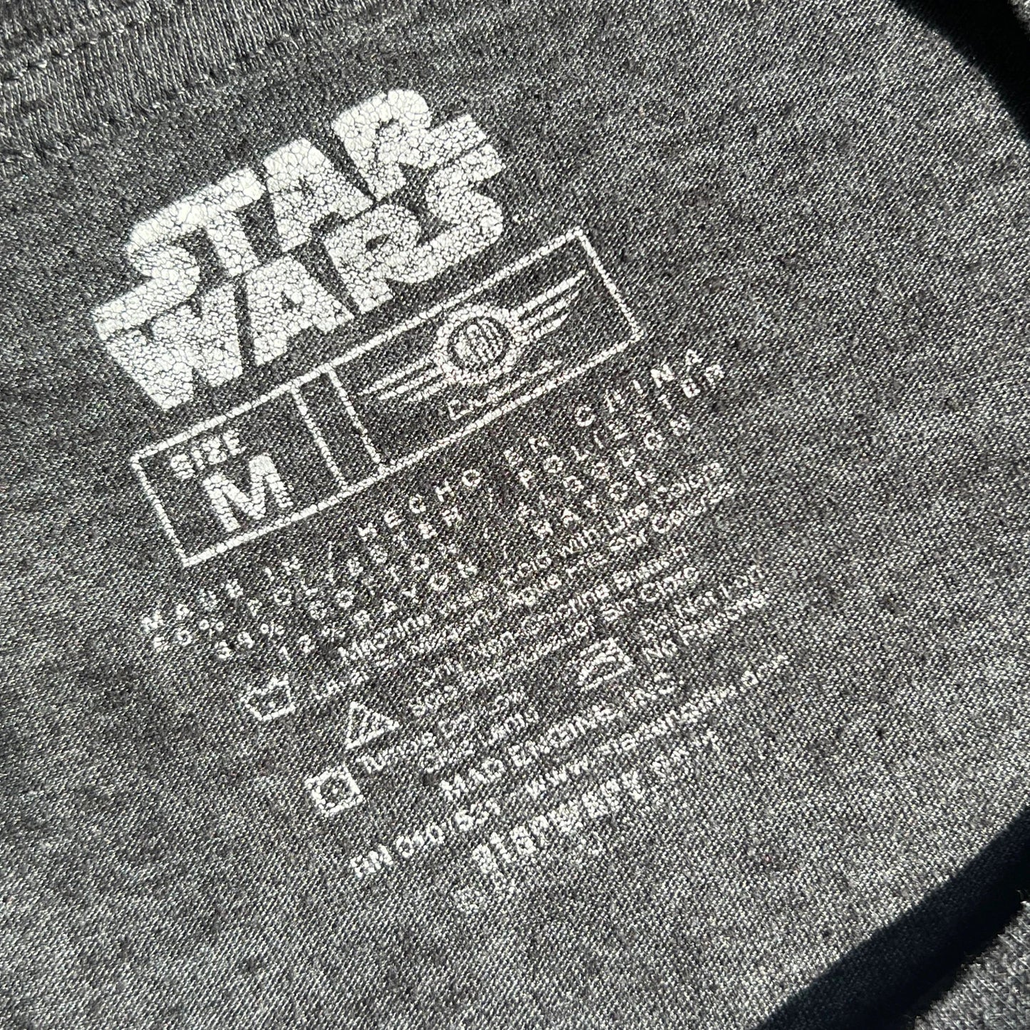 Grey t-shirt with Star Wars carelabel with garment information