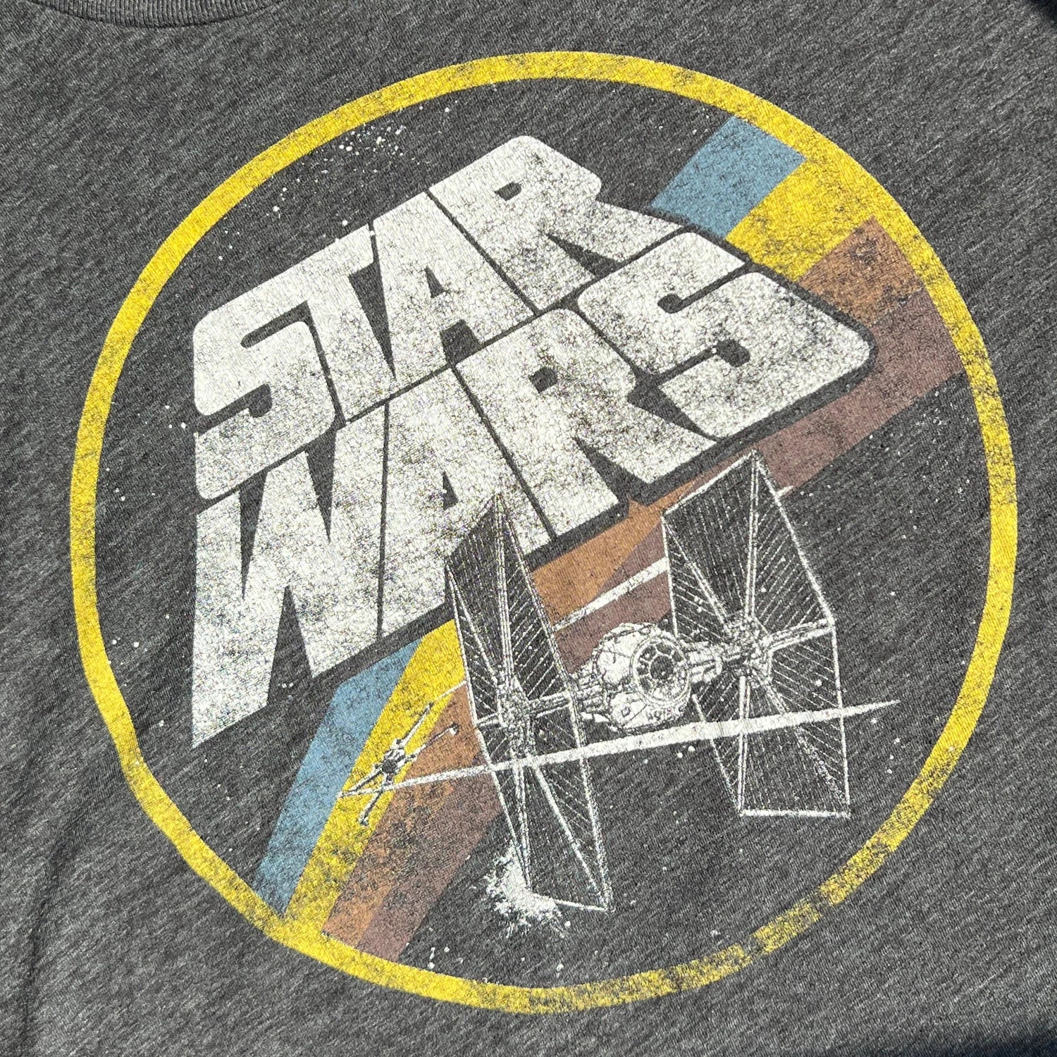 Dark gray t-shirt with Star Wars logo and a TIE Fighter print