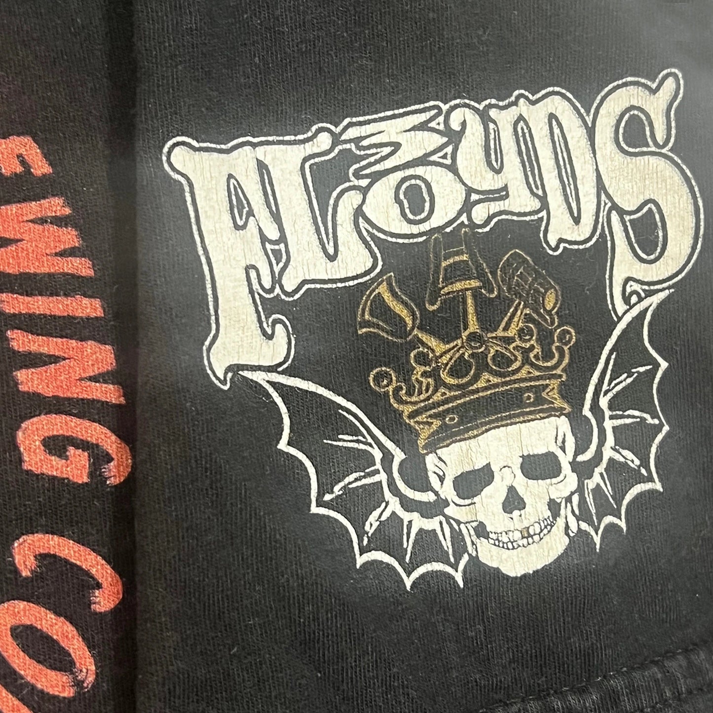 A skull print and FL30YDS design a on black t-shirt sleeve